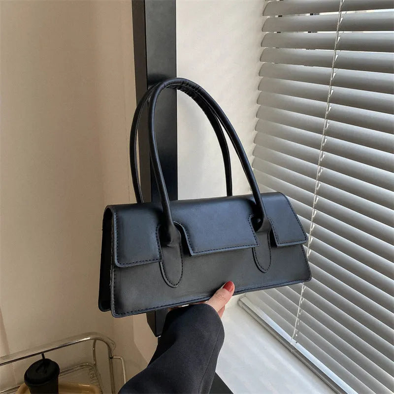Women's small square shoulder bag in PU leather showing horizontal design with stitching details