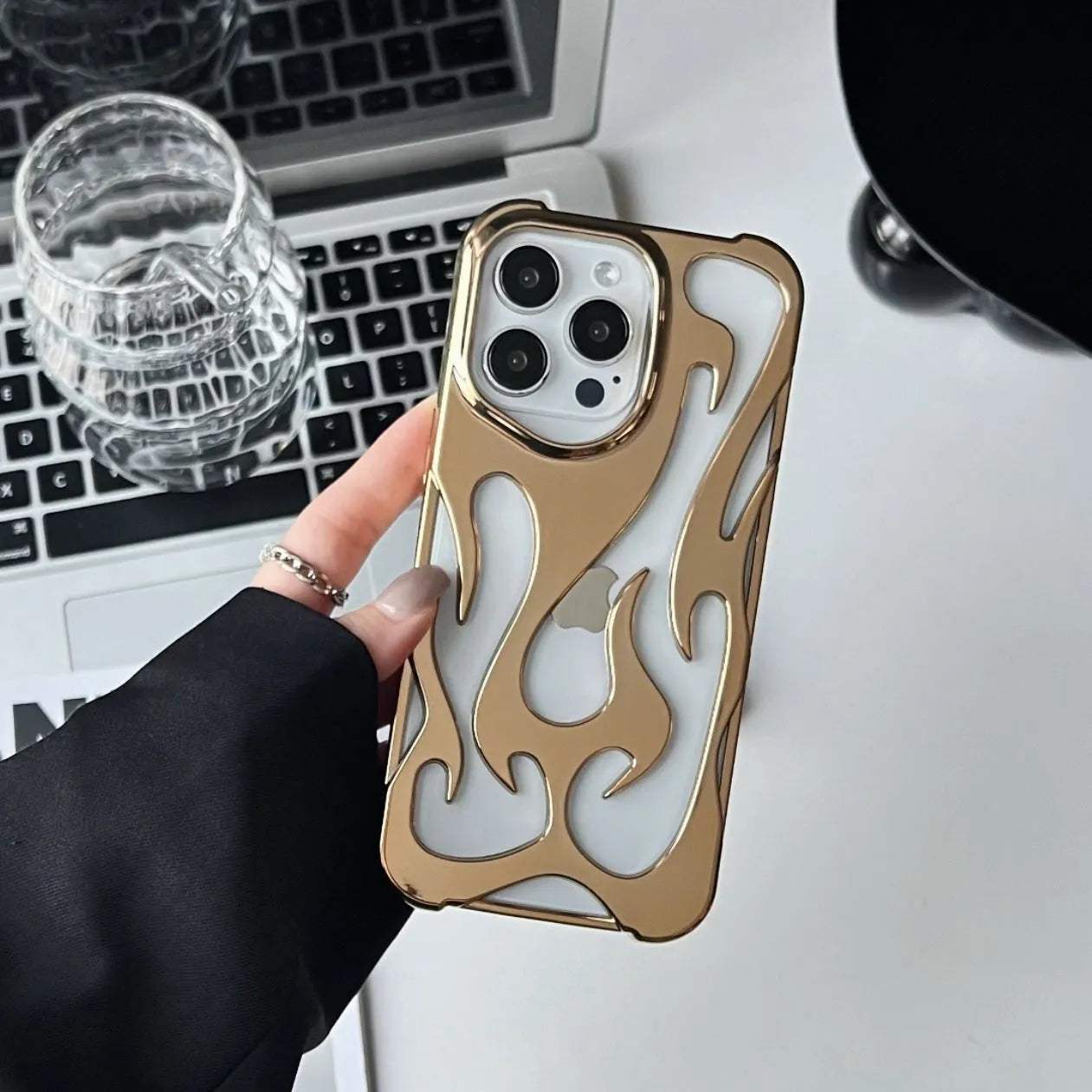 Electroplated hollow flame pattern soft TPU phone case for Apple iPhone, shown in silver on a dark background.