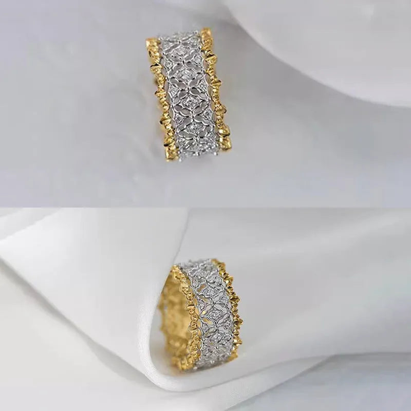 Geometric two-tone gold and silver zircon ring on a plain background, showing its round design element.