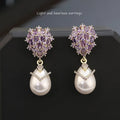 Women's drop-shaped pearl and zircon earrings with 18K gold plating in three colour variations.