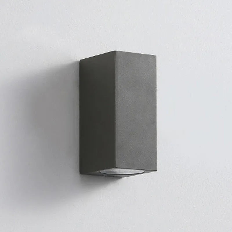 Modern black aluminium LED wall lamp with glass shade and silicone rubber trim.