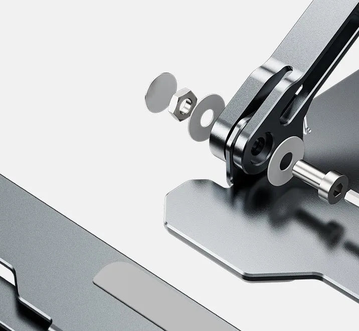 Grey aluminium folding laptop stand shown at an adjustable angle on a wooden desk.