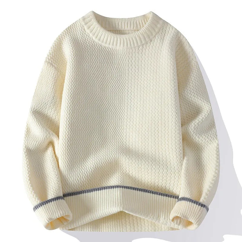 Man wearing a grey loose-fit round neck knitwear pullover sweater for casual autumn wear.