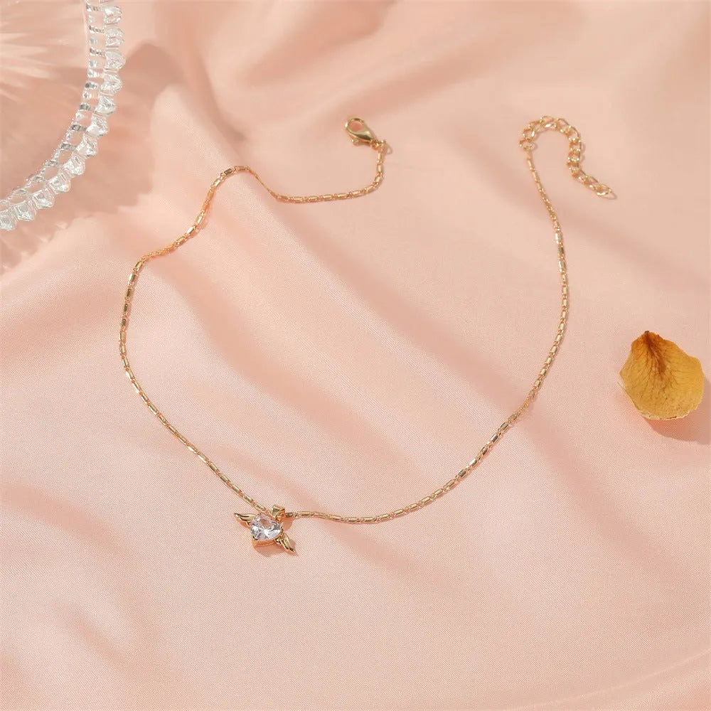 Heart wings necklace for women, copper pendant in gold finish, love themed jewellery