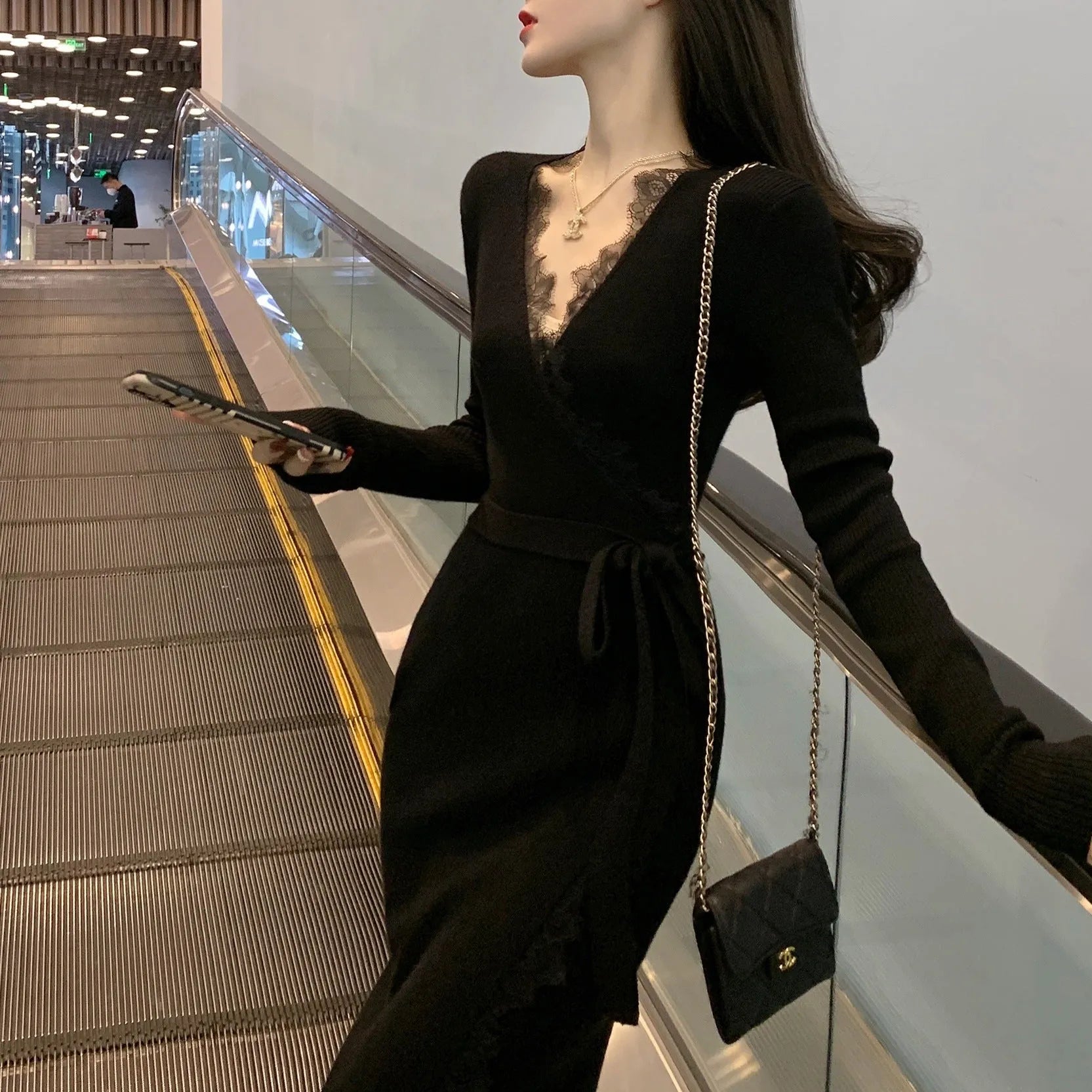 Black women's slim fit woolen skirt with a princess dress silhouette on a mannequin.