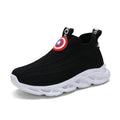 Black and white knitted sleeve-style overshoes with MD sole for runway wear