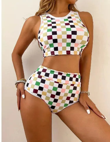Women's black and white checkerboard plaid backless racing swimsuit with suspender straps.