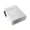 Black YG530 mini mobile phone projector on table projecting image on wall