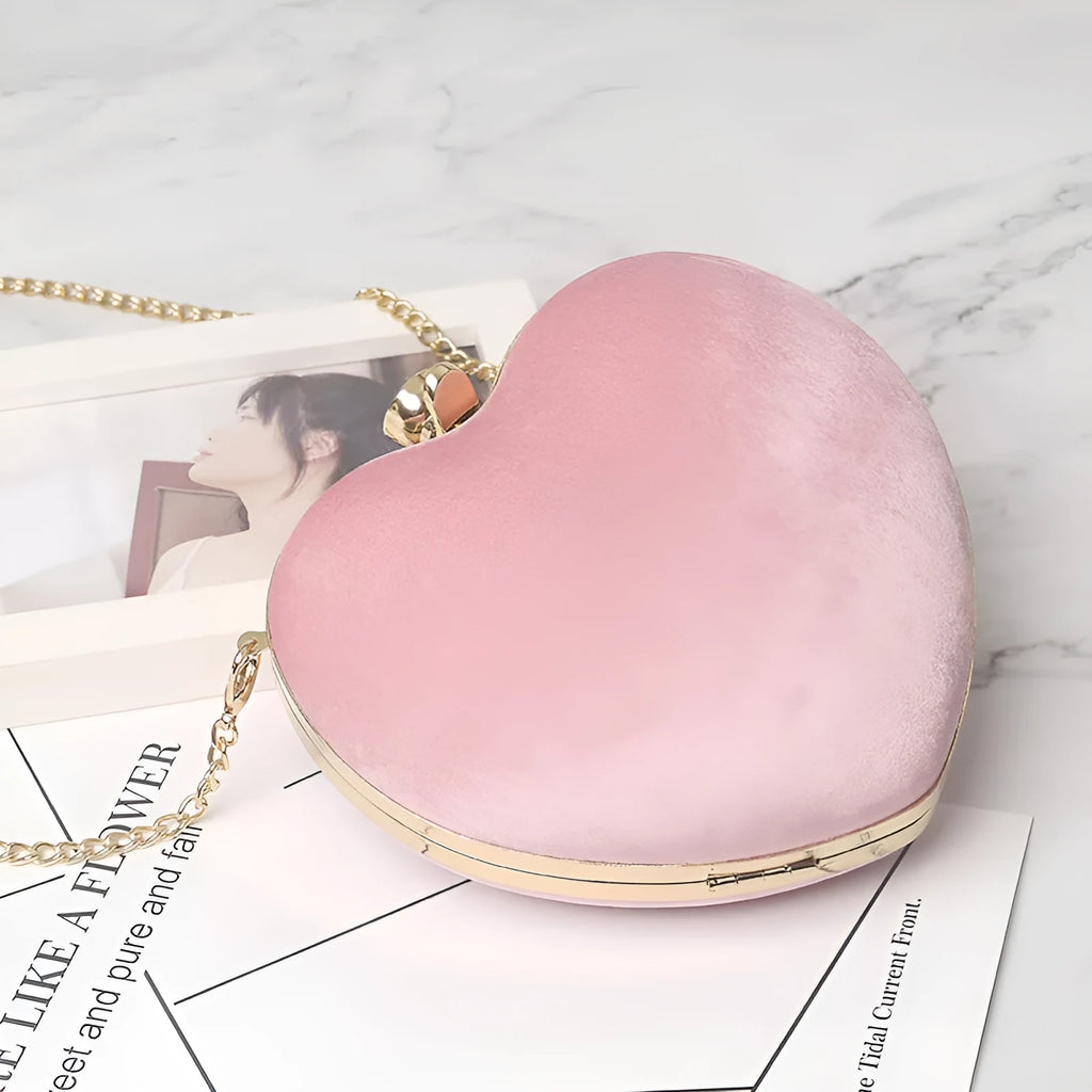 Heart-shaped plush cotton chain bag with card pocket in pink colour on plain background
