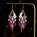Long bohemian-style women's earrings with hand-woven artificial crystal in a diamond shape.