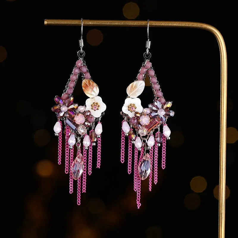 Long bohemian-style women's earrings with hand-woven artificial crystal in a diamond shape.