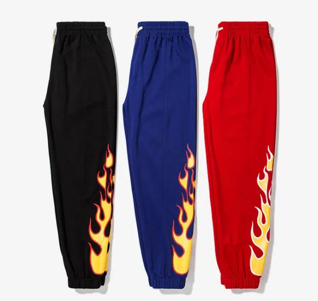 Hop flame print joggers for men and women in black, loose fit cotton blend sweatpants with red, blue flame pattern
