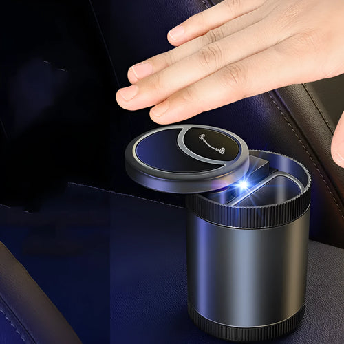 Automatic induction ashtray in black with USB cable, suitable for car, home, or office.