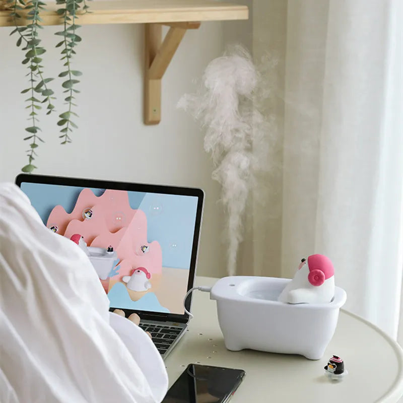 White USB-powered desktop air humidifier with large water tank on a desk.