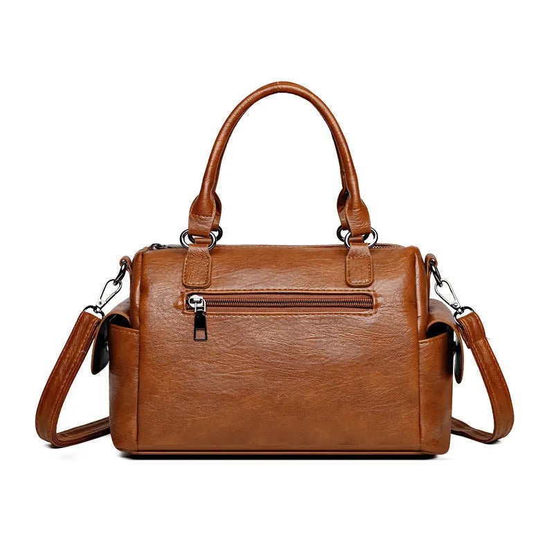 Vintage style messenger bag in PU leather, shown in a horizontal square shape with contrast stitching.