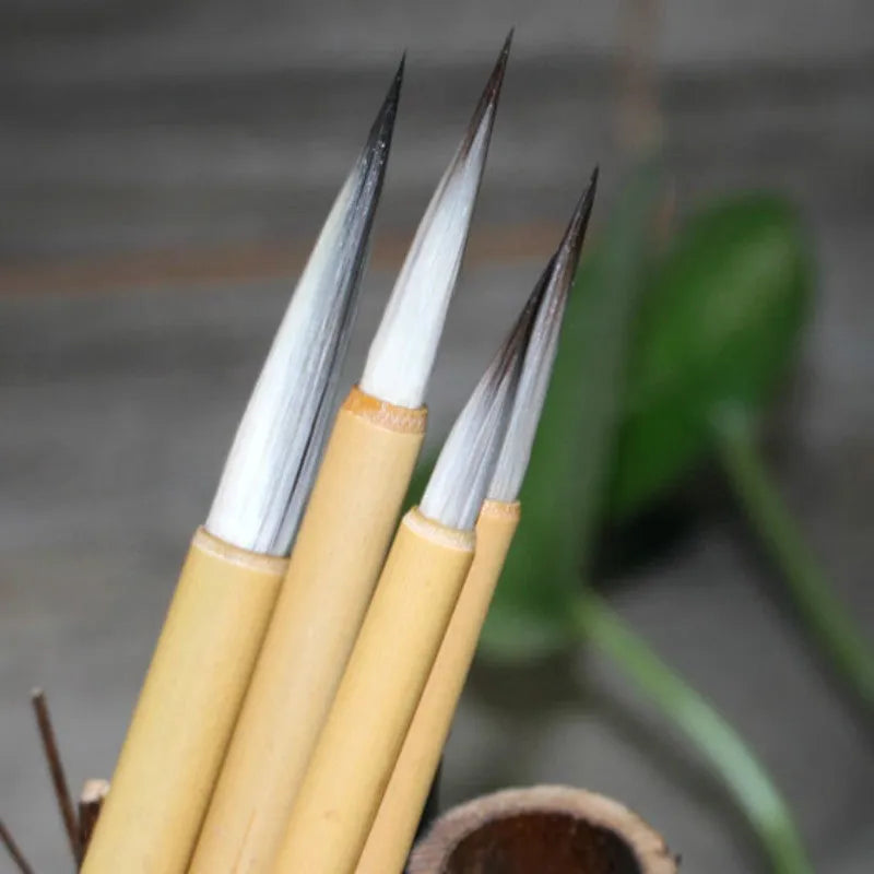 Traditional writing brush set with mixed hair construction and thin gold body design