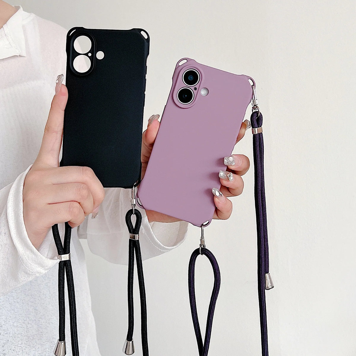 Four-corner cross lanyard liquid silicone phone case for Apple iPhone 16 Pro Max in black with detachable crossbody strap