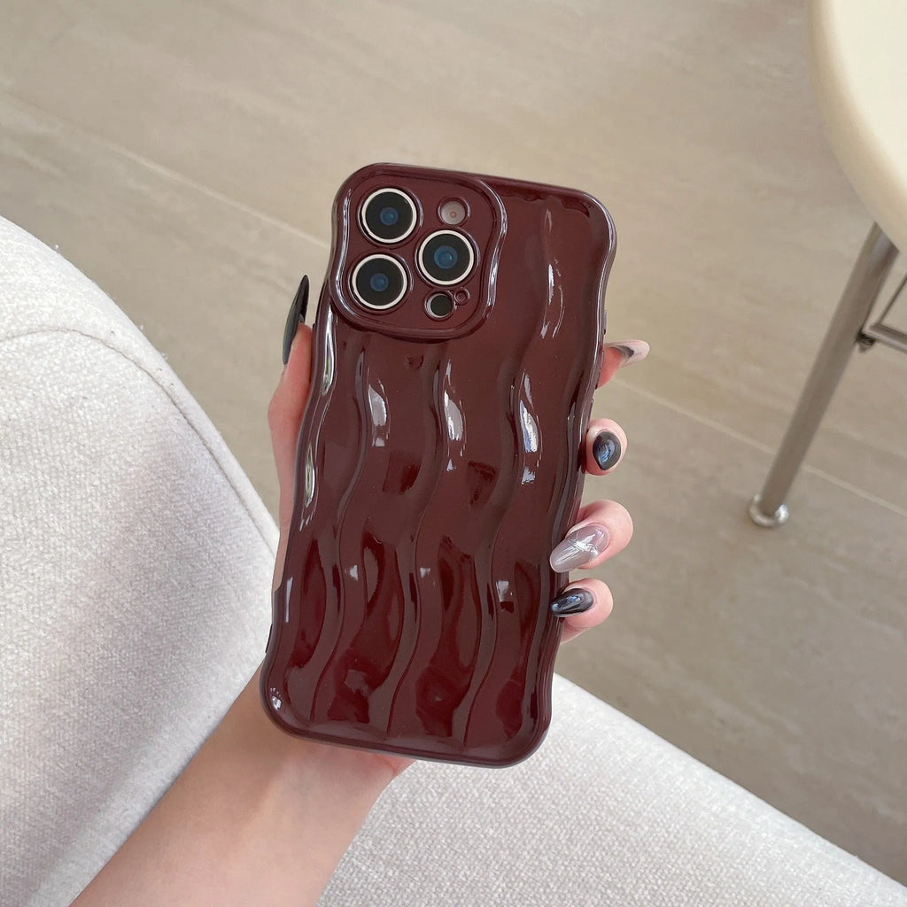 iPhone 17 Pro Max phone case with electroplated silver wave stripe design on black TPU back cover.