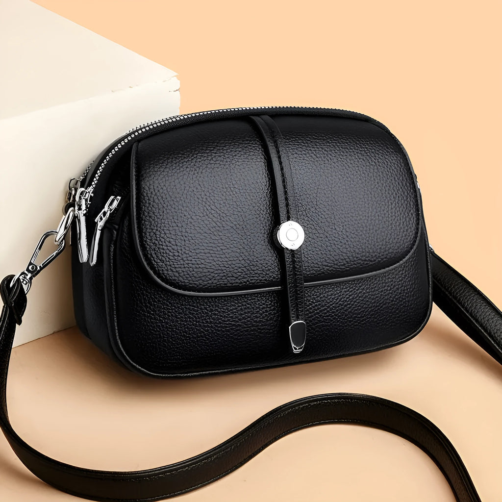 Women's soft PU crossbody shoulder bag with oval suitcase shape in black, khaki, or dark brown