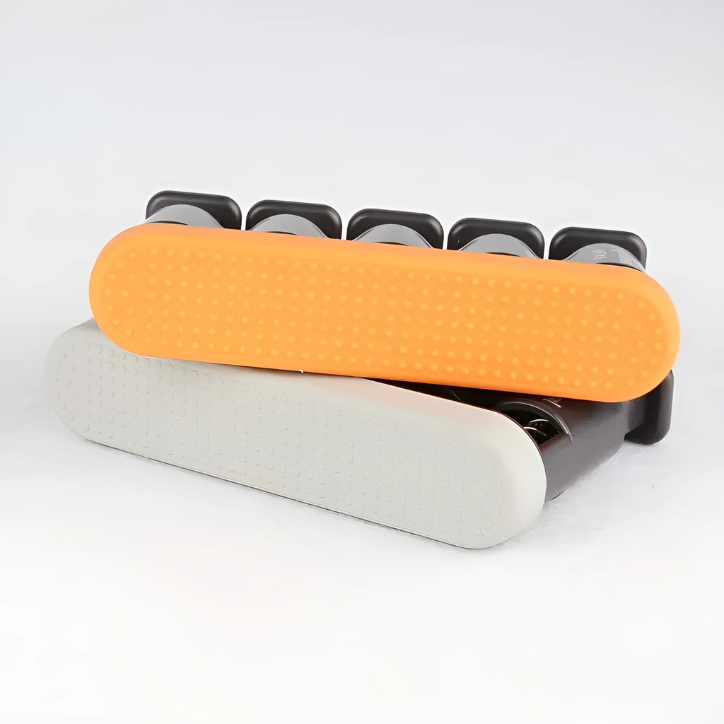 Grey and orange silicone finger trainer for musician hand muscle development