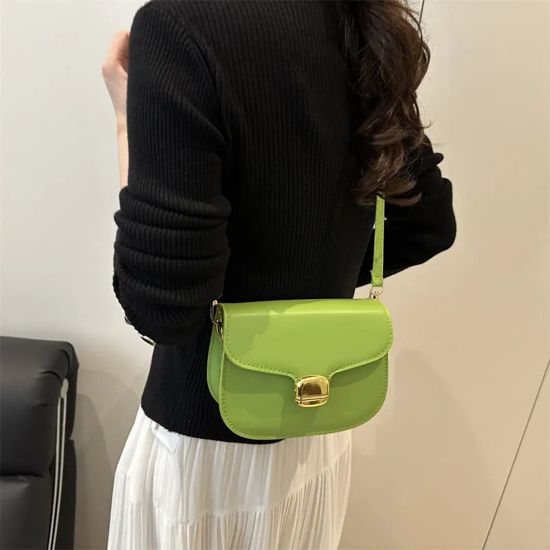 Simple PU handbag for women in one of six colours, showing interior with zippered change purse and phone pocket.