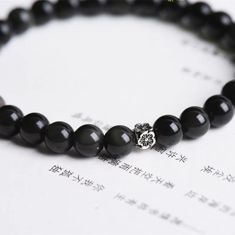 Natural obsidian bracelet with S925 silver flower accessories showing 6mm stone beads