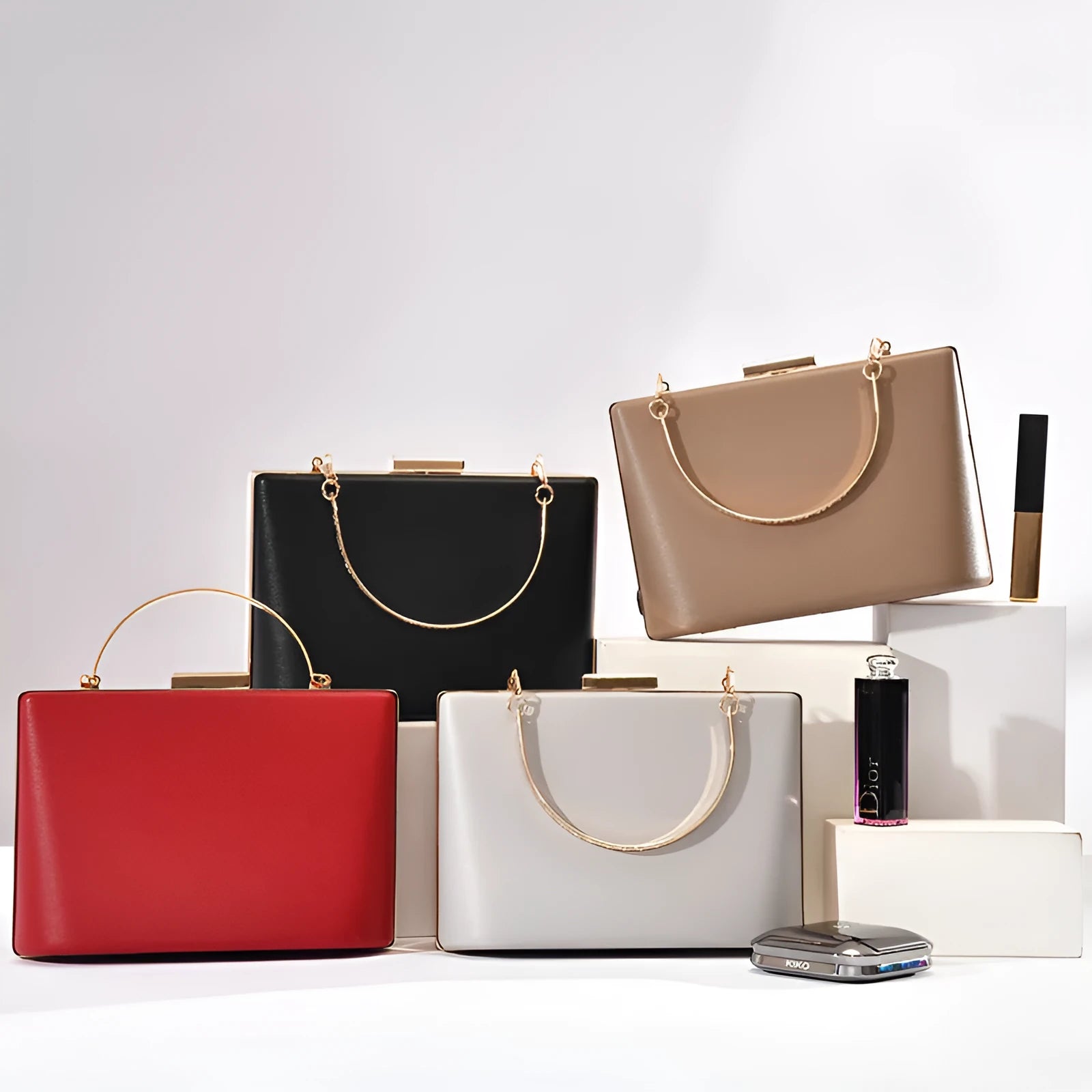 Solid colour PU leather crossbody bag in pillow shape with double-ring detail, 18.5x13.5x7cm, in black.