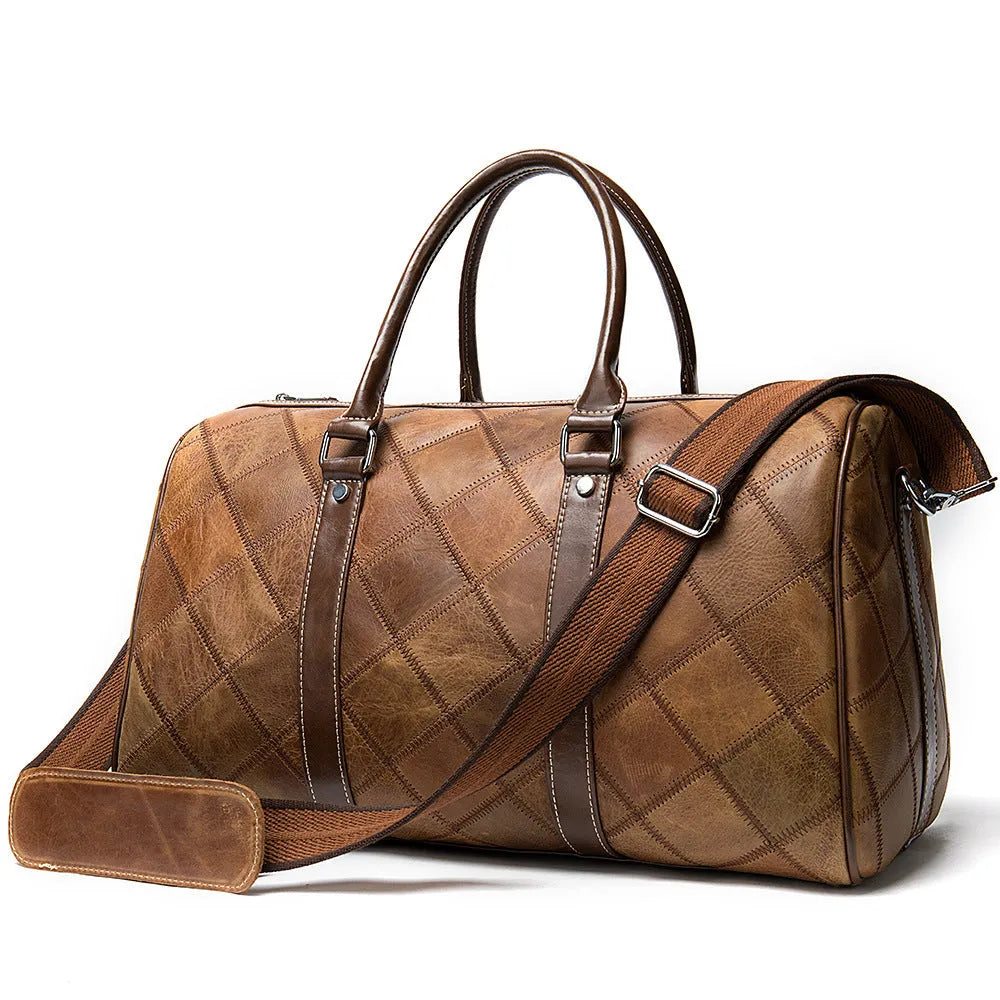 Vintage checked men's leather duffel bag with a single shoulder strap, shown in a light coffee colour.