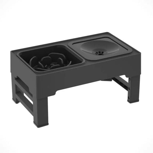 Black adjustable height dog feeding stand with two stainless steel bowls elevated on plastic stand