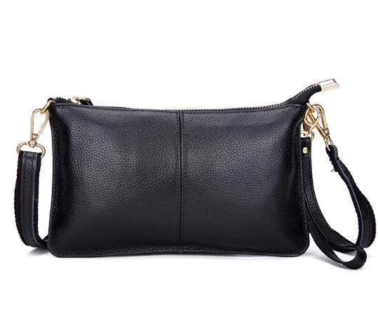 A cowhide lady slant bag in a chosen colour, showing hand and shoulder straps, with dimensions of 24 cm by 14 cm.