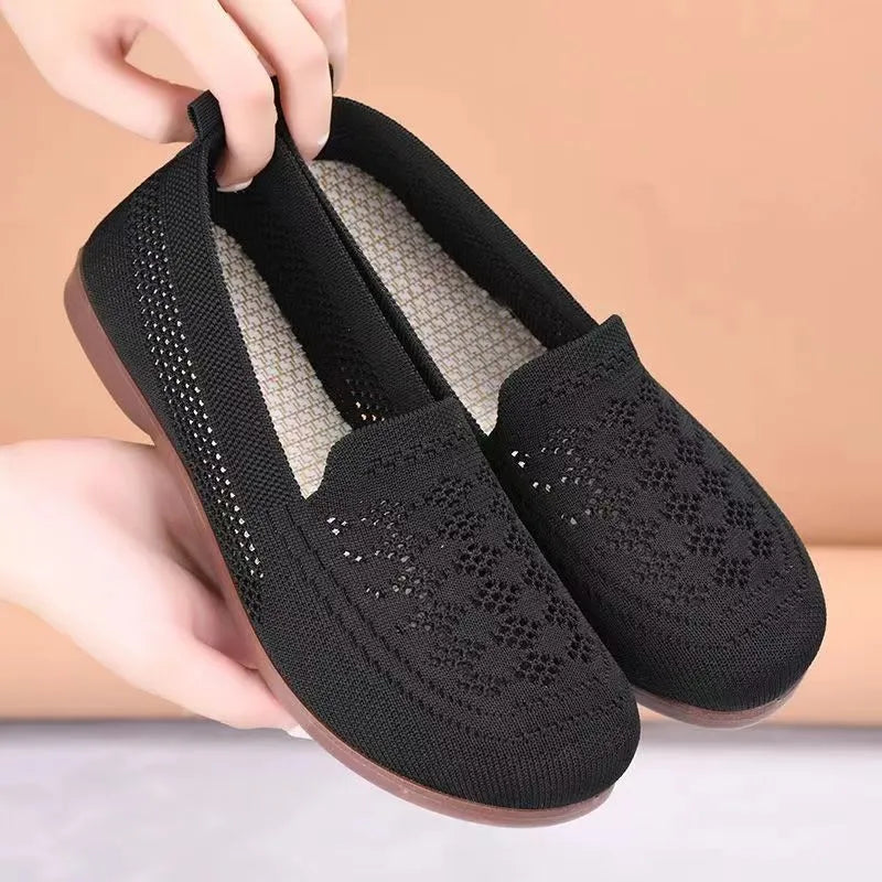 Women's beige low-top casual slip-on shoes with mesh upper and round toe.