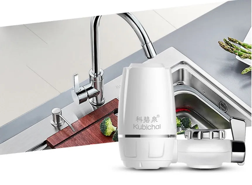 White plastic faucet water filter with ceramic cartridge and set of thread adapters