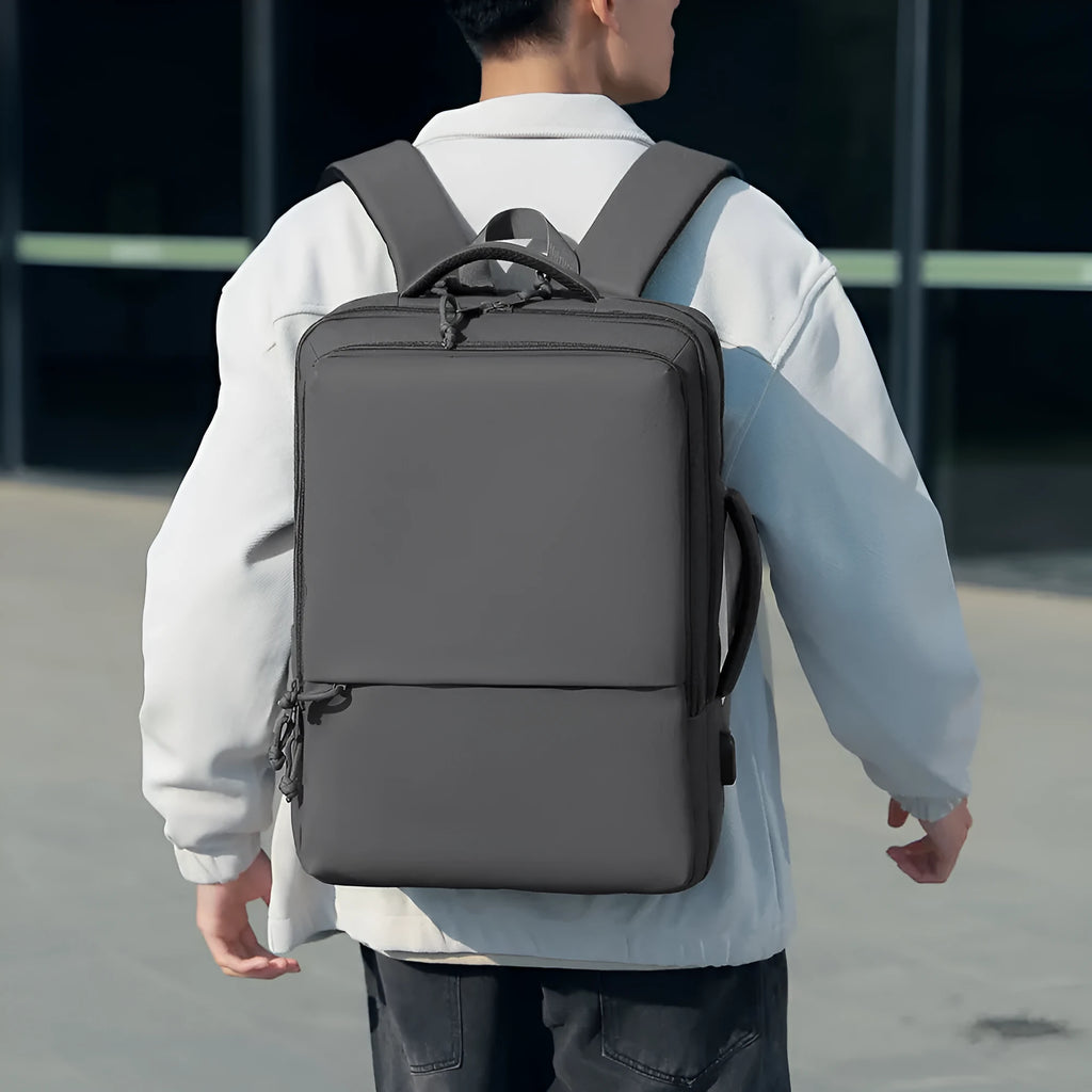 Green waterproof Oxford cloth backpack for business travel with air pillow straps, 45cm tall.