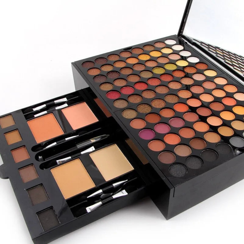 Piano keyboard-shaped makeup palette open to show 180 eyeshadows, blushers, and contour powders.
