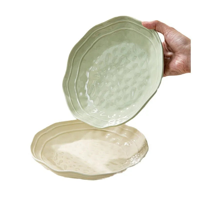 Solid colour ceramic dinnerware set with plates and bowls in modern Japanese minimalist style.
