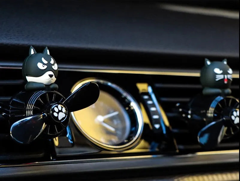 Set of four car air vent ornament designs: black husky, black cat, pink cat, and pink duck on cloth bags.