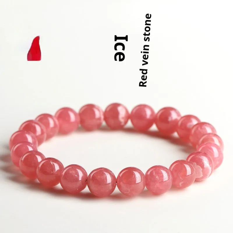 Women's geometric red rhodochrosite crystal bracelet with a longevity lock on a white background.