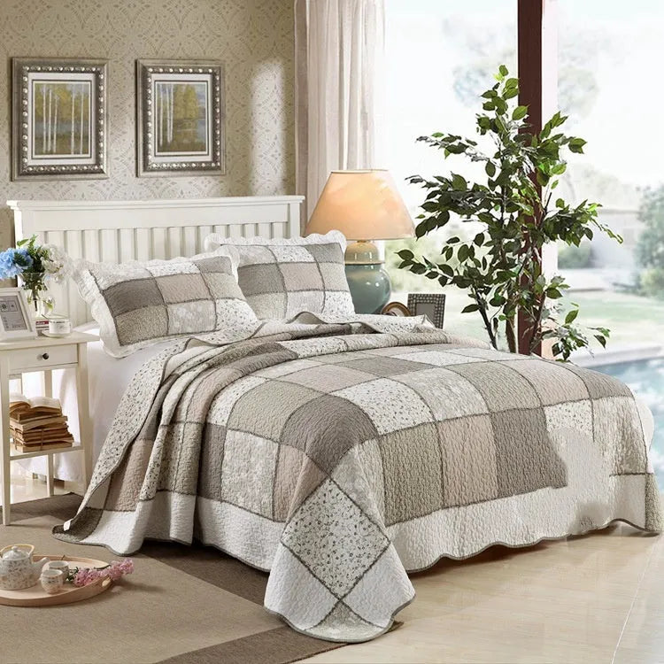 Washed pure cotton quilted bedspread and pillowcases in a beige colour, showing textured fabric.