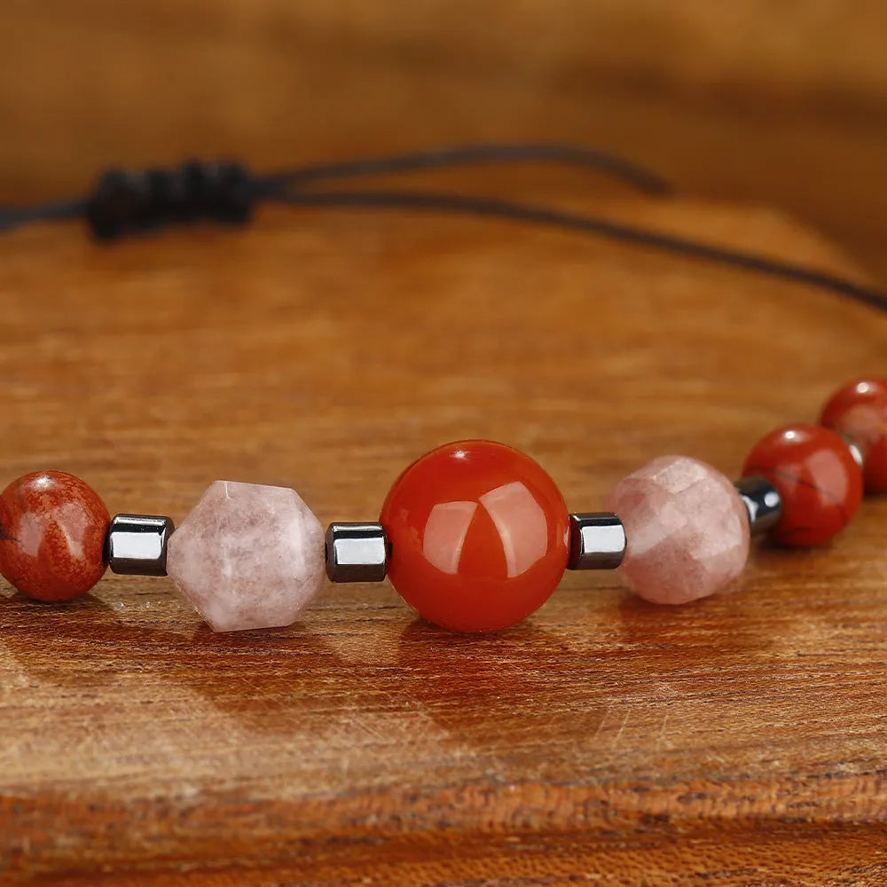 Handmade red geometric bracelet with sunstone, redstone, and copper beads.