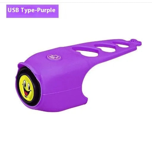 Bicycle electronic horn with plastic casing in multiple colours including black, green, purple on bicycle handlebars