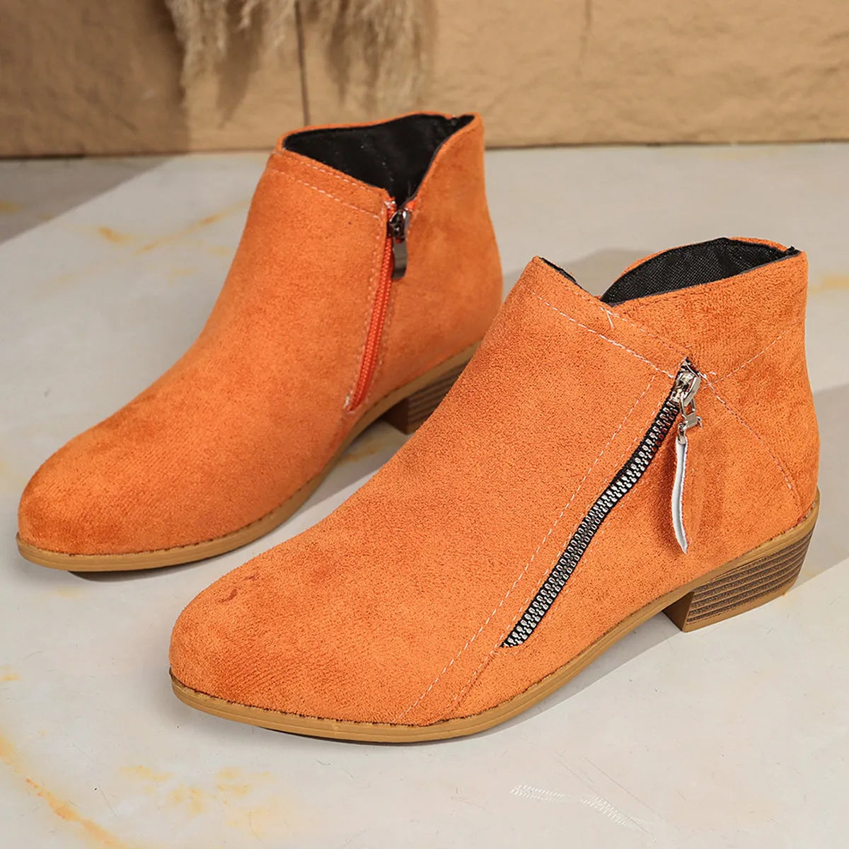 Suede women's ankle boots with side zipper, pointed toe, rubber sole, in black, brown, grey, red, beige, orange, dark blue, sky blue, purplish red.
