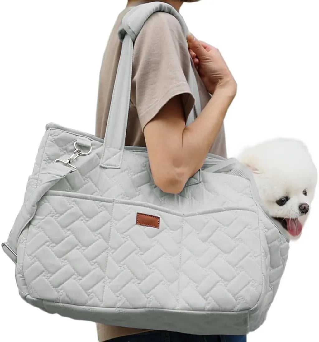 Grey handbag-style pet carrier for cats and small dogs with mesh windows and multiple pockets.
