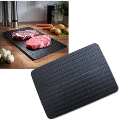 Black aluminium kitchen defrosting tray for thawing frozen meat and food without electricity