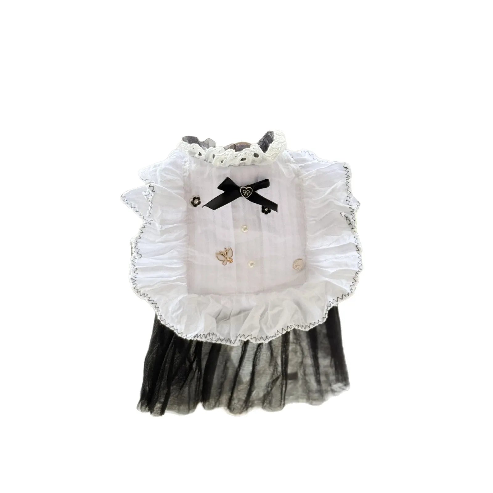 White yarn gauze skirt for small dog on a table, showing princess-style tiered design and lightweight fabric.