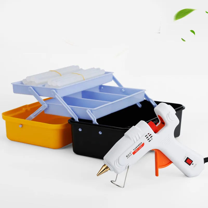 White electric hot melt glue gun with metal stand and anti-heat blanket on a work surface