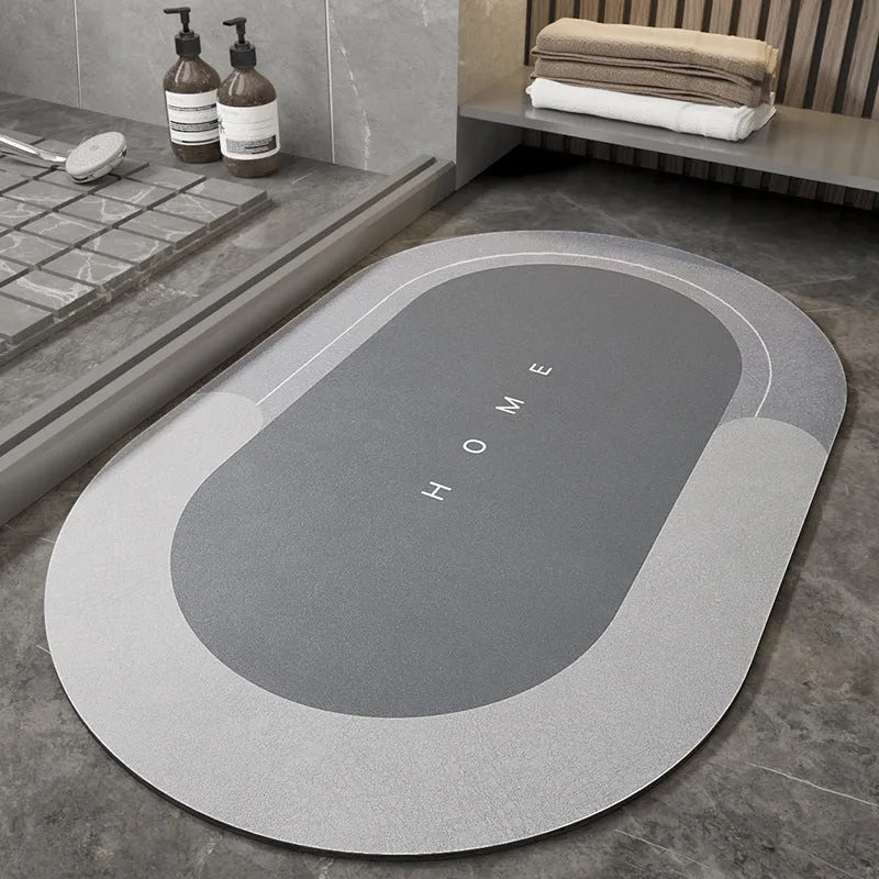 Machine-woven rectangular blue floor mat placed on a bathroom floor.
