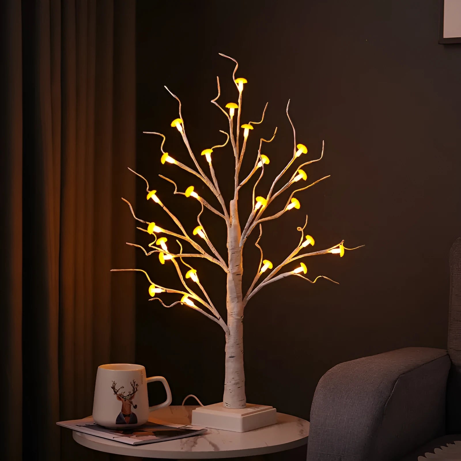 60 cm tall white birch tree LED lamp with small mushroom-shaped flowers glowing with warm light.