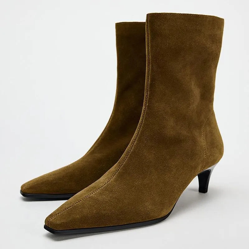 Women's brown square toe ankle boots with a side zip and a stiletto kitten heel on a white background.