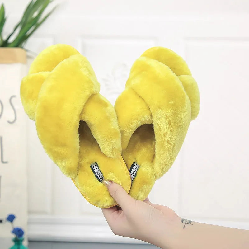 Women's cross open-toe fur slippers in assorted colours on a patterned non-slip sole.