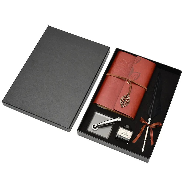 Feather dip pen gift set with copper pen, ink bottle, acrylic base, and antique book in box